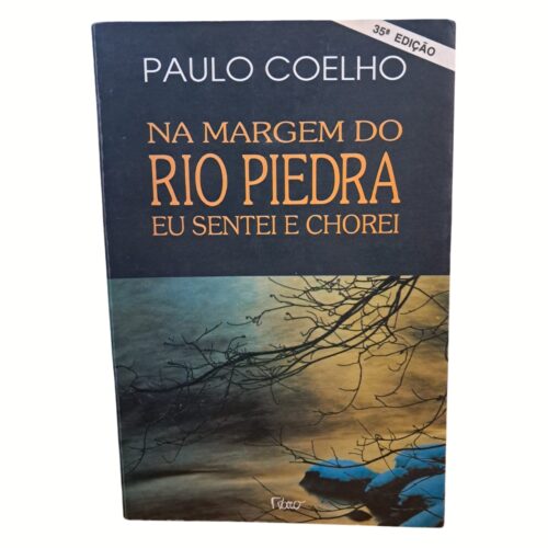 Livro - Na Margem do Rio Piedra eu sentei e Chorei - Paulo Coelho (Usado)
